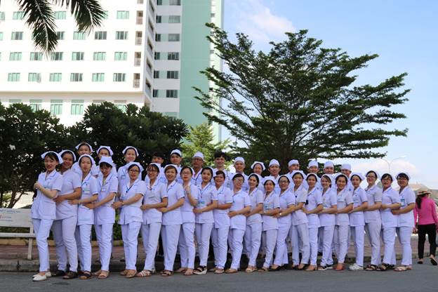 A group of people in white uniforms
Description automatically generated with low confidence