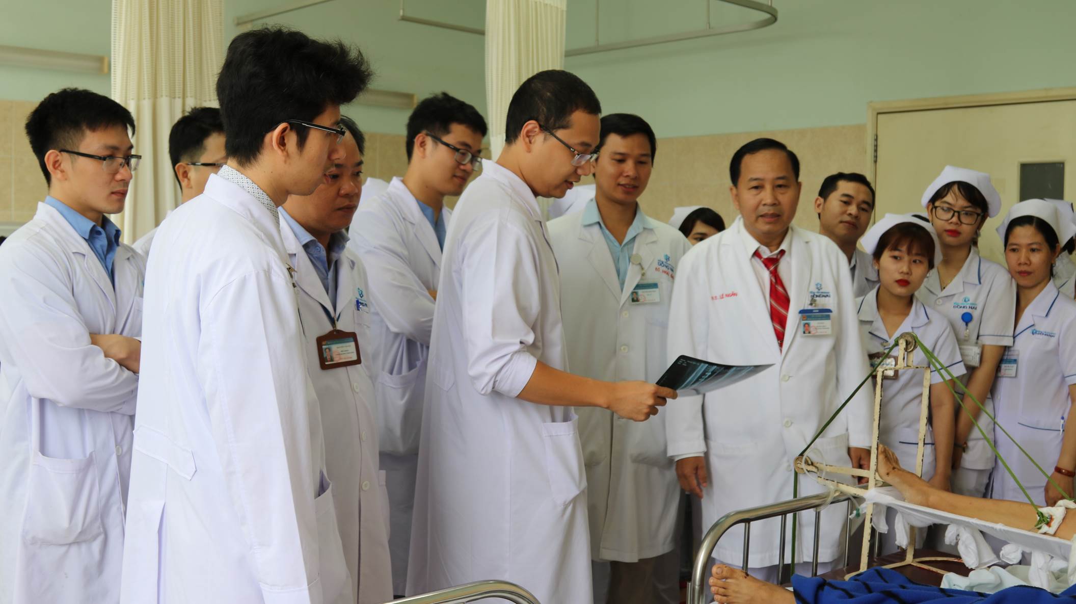A group of people in white coats
Description automatically generated with low confidence